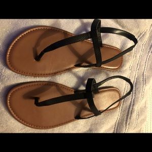 Women’s black sandals with closed back